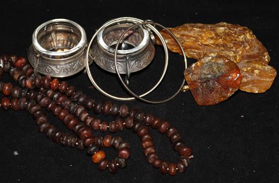 A pair of salts, assorted amber and a bracelet.